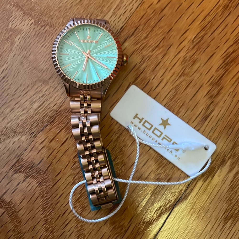 Rose gold european watch with pastel green face